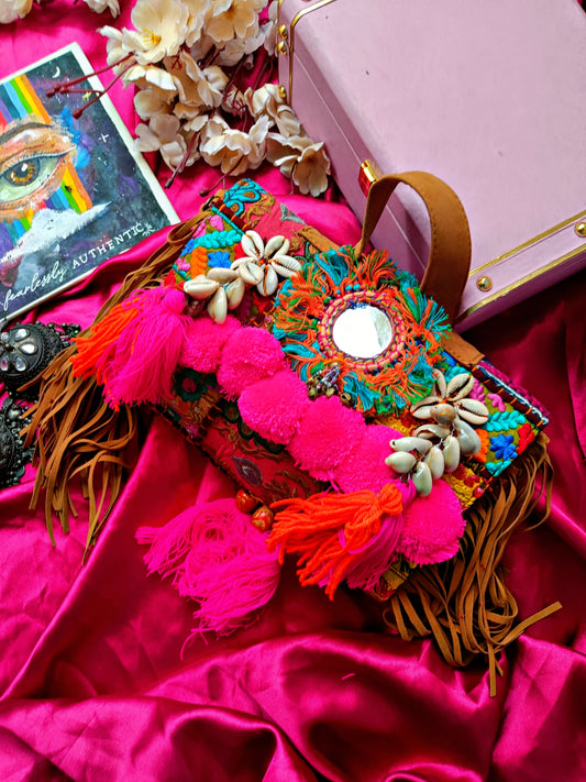 Boho bag with pink pompoms